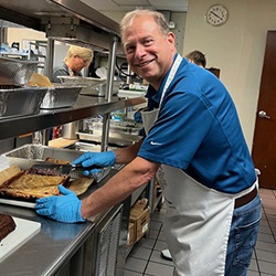 Samaritan Place - Lyle slicing desserts